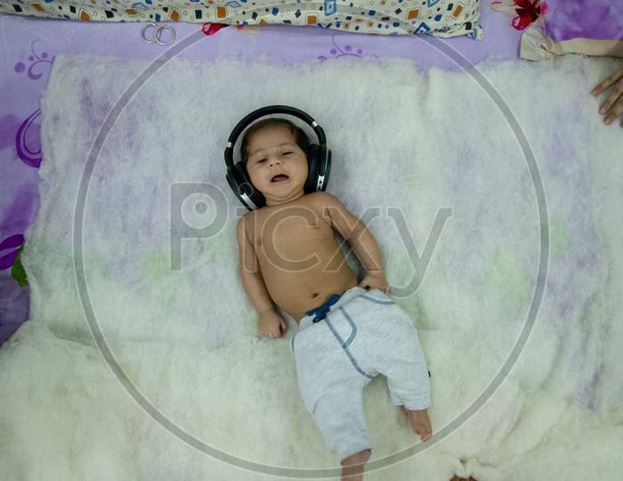 Adorable Cute Little Girl  Wearing Headphones