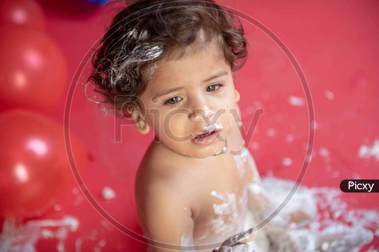 image-of-cake-breaking-ceremony-on-baby-turning-1-year-birthday