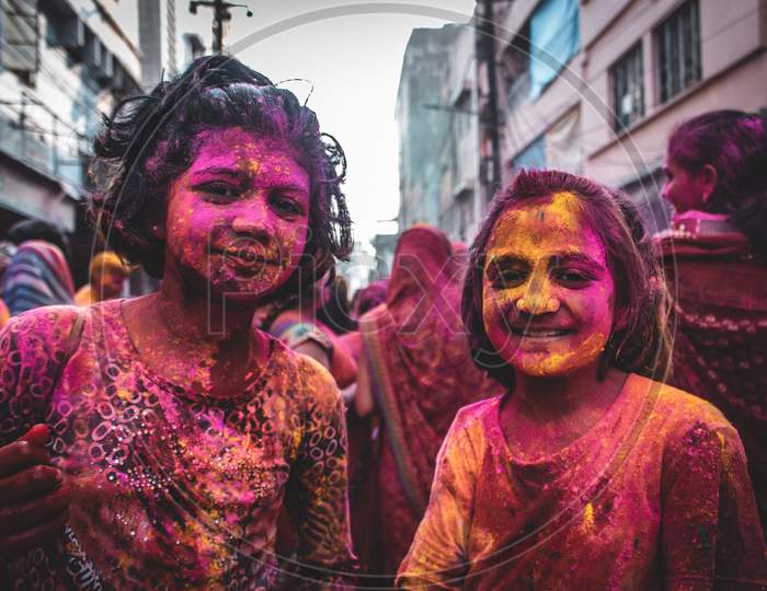 Girls playing holi with colours