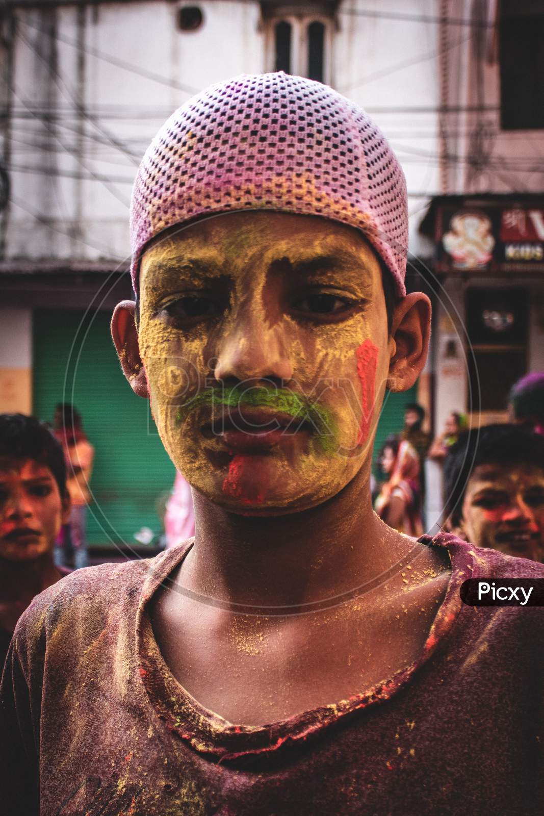 A muslim boy with colours on his face