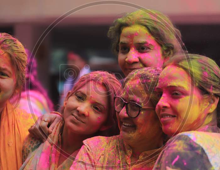 Young Indian Woman Celebrating Holi Festival With Colour Splash
