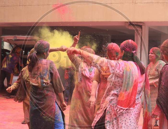 Young Indian People Celebrating Holi Festival With Colour Splash
