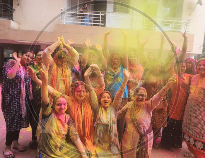 Young Indian People Celebrating Holi Festival With Colour Splash