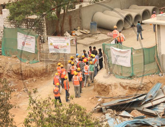 Construction Workers Entering Into a Construction Site
