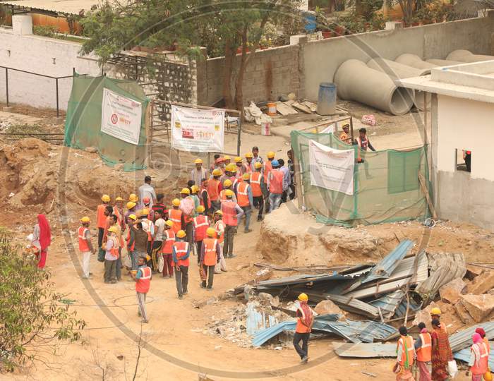 Construction Workers Entering Into a Construction Site