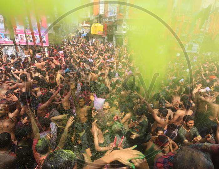 Crowd Of Young Indians  Celebrating Holi With Colour Splash  During Holi Festival
