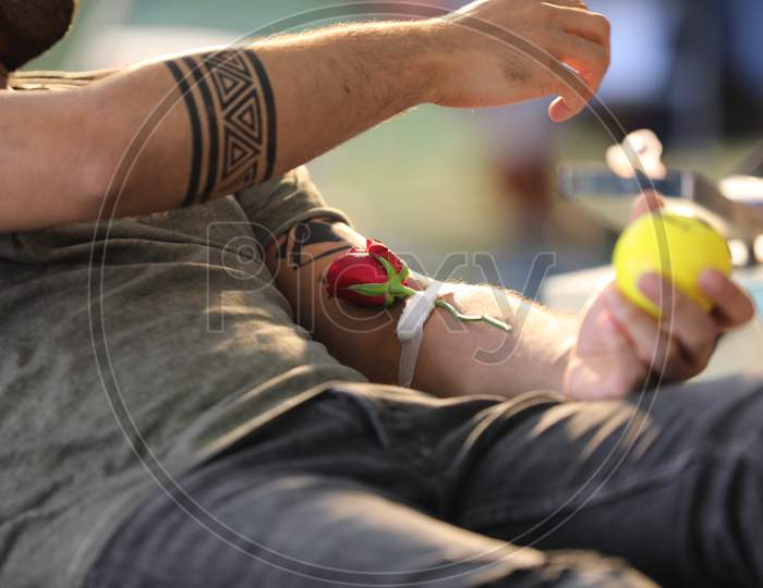 Young Man  Donating Blood At a Blood Donation Camp