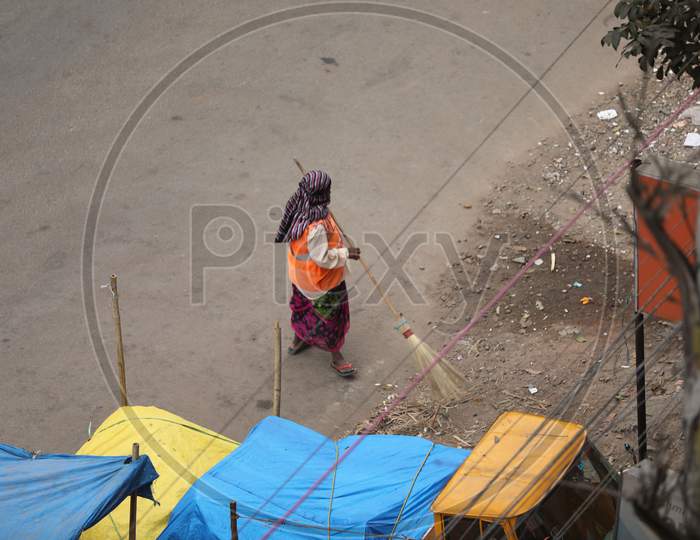 GHMC Sanitary Worker Or Sweeper Sweeping The Streets