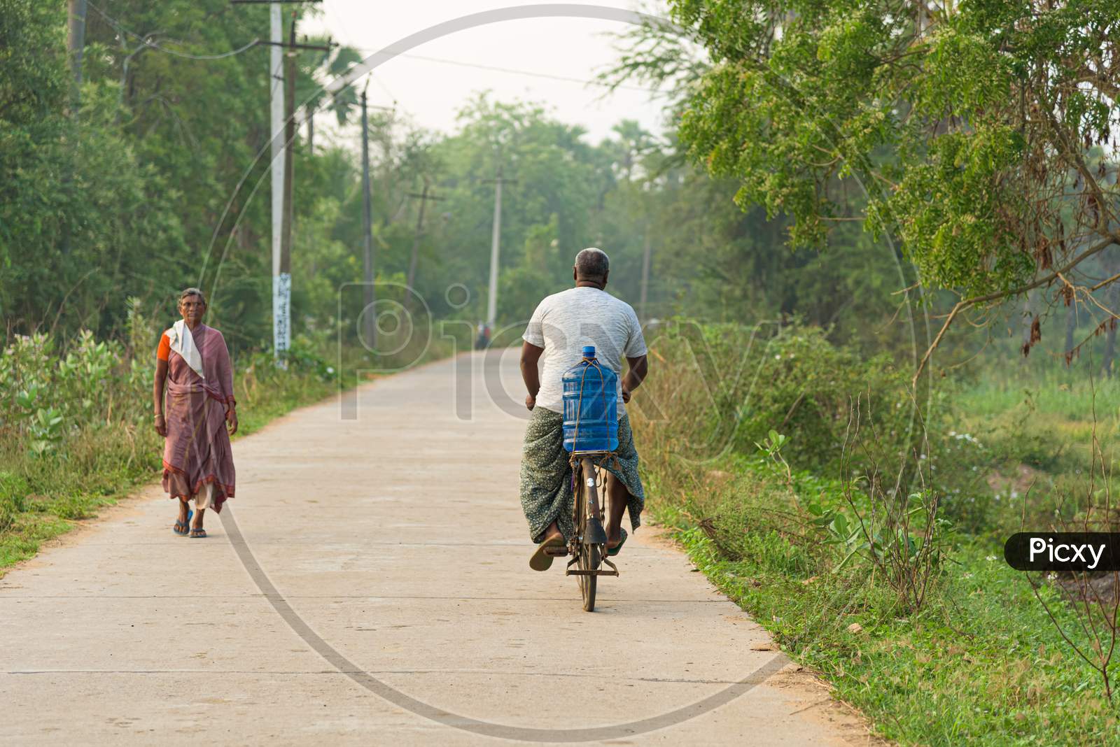 Man Riding a bicycle on a road