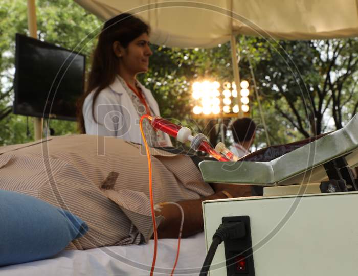 Young Man Donating Blood At a Blood Donation Camp