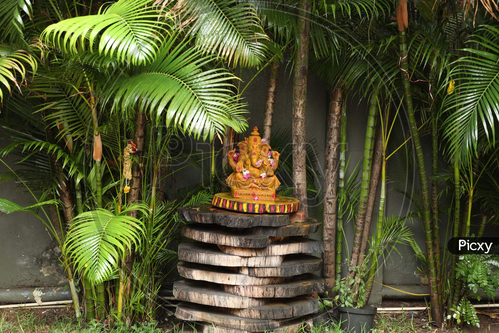 Hindu God Lord Ganesh Idol In an House Lawn Garden