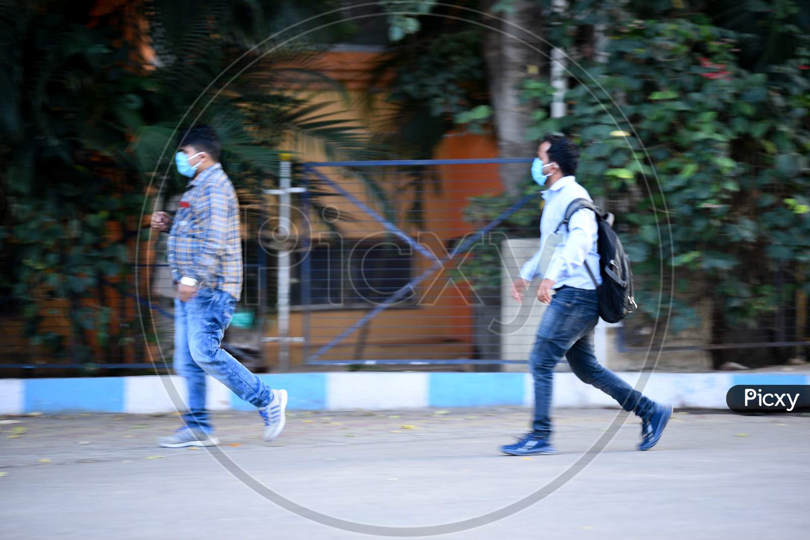 Men wearing face masks enter Gandhi Hospital