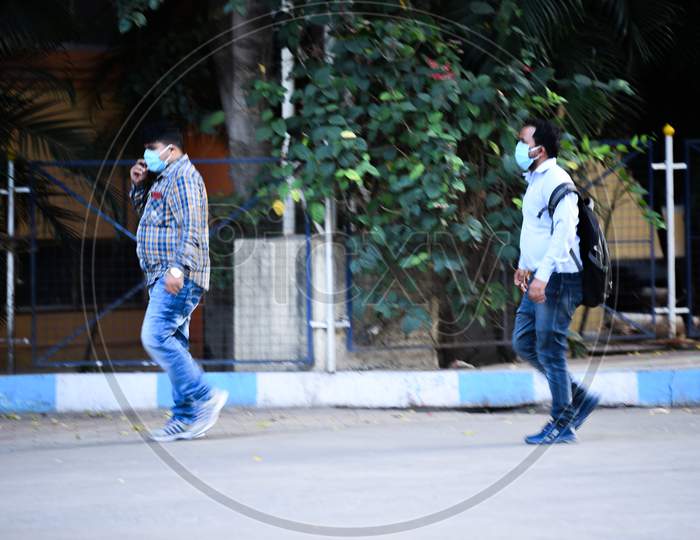 Men wearing face masks enter Gandhi Hospital
