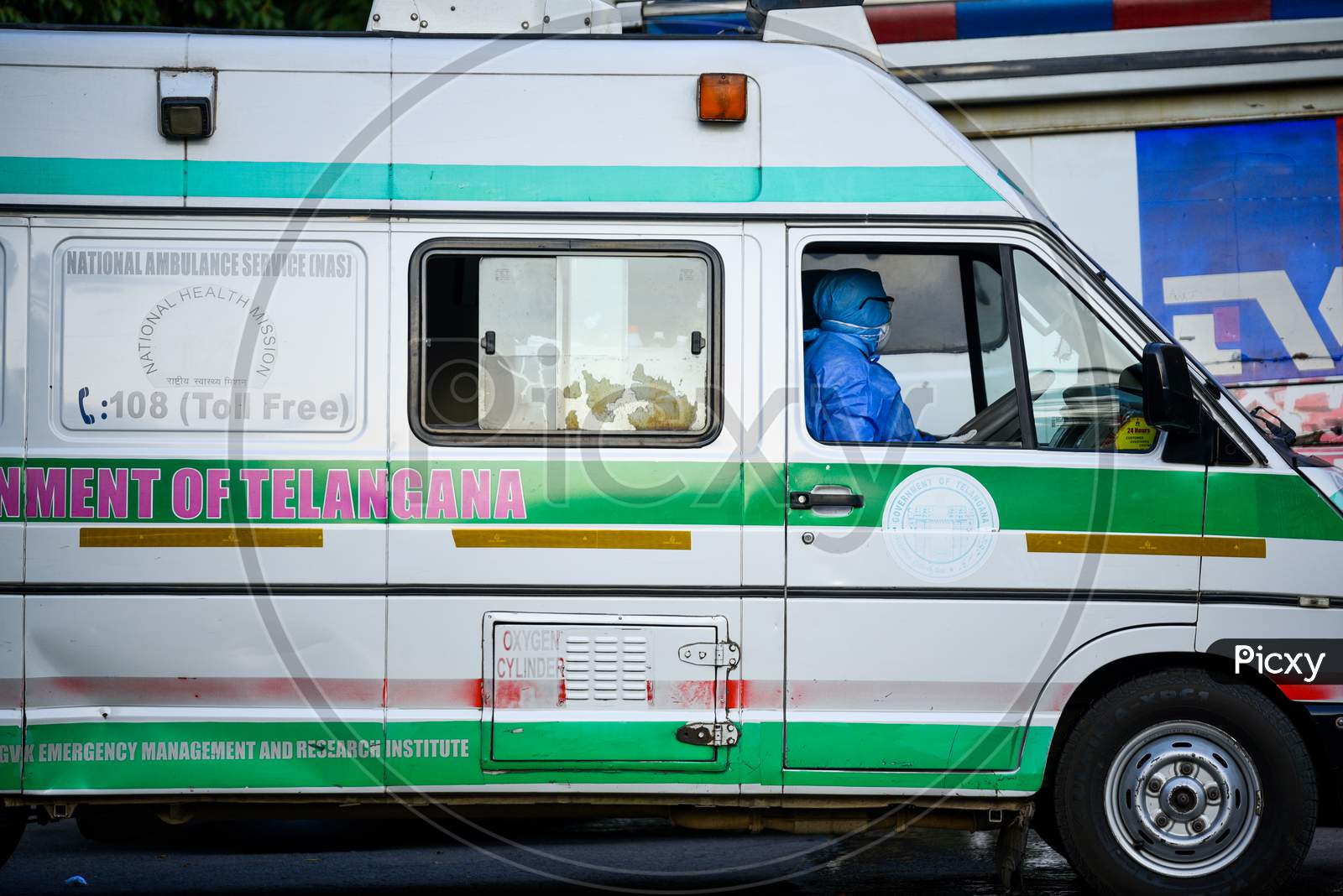 An Ambulance driver wearing full body suit and face mask at Corona Virus Isolation ward at Gandhi Hospital,Hyderabad.