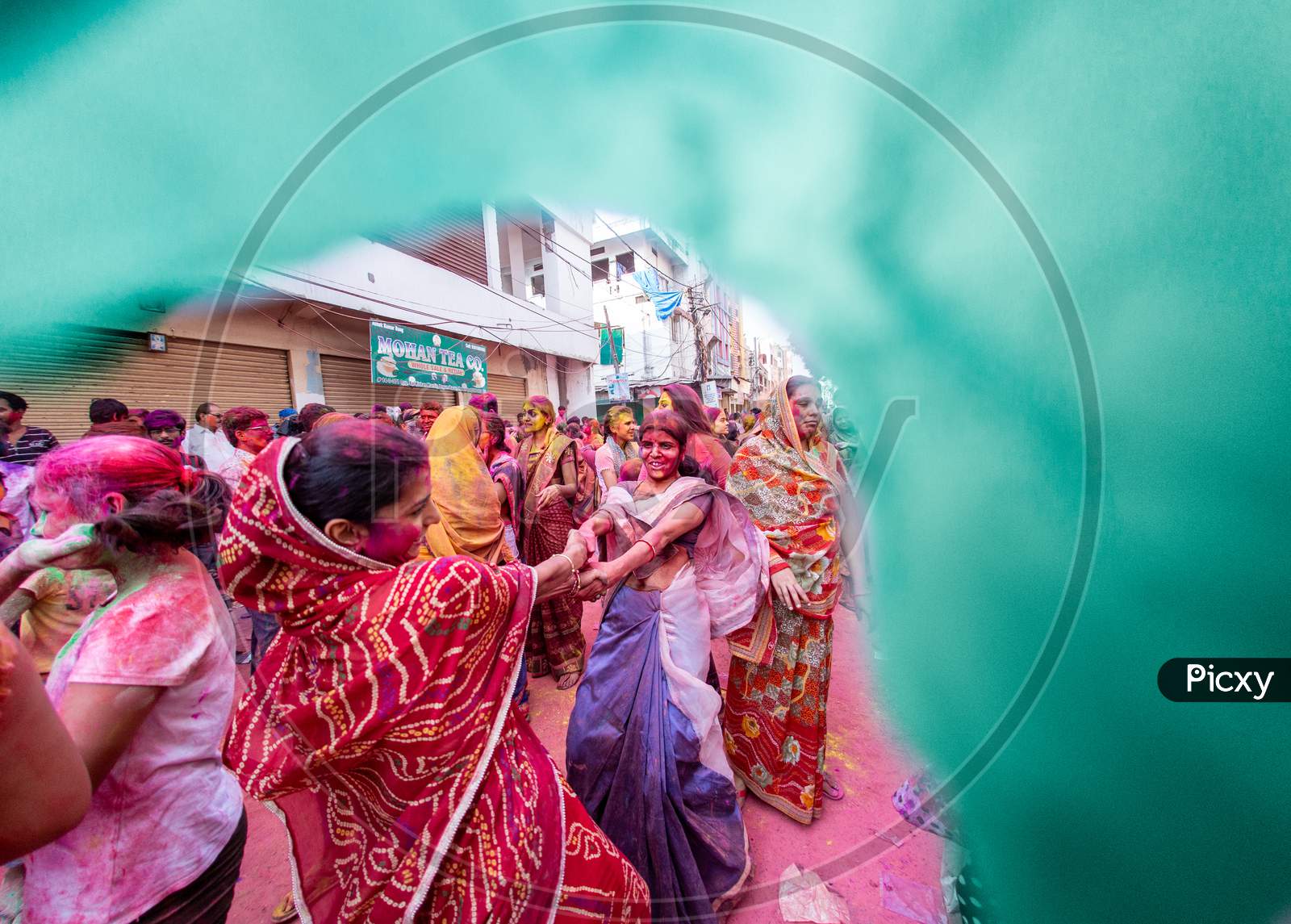 Indian Woman Celebrating Holi By Dancing
