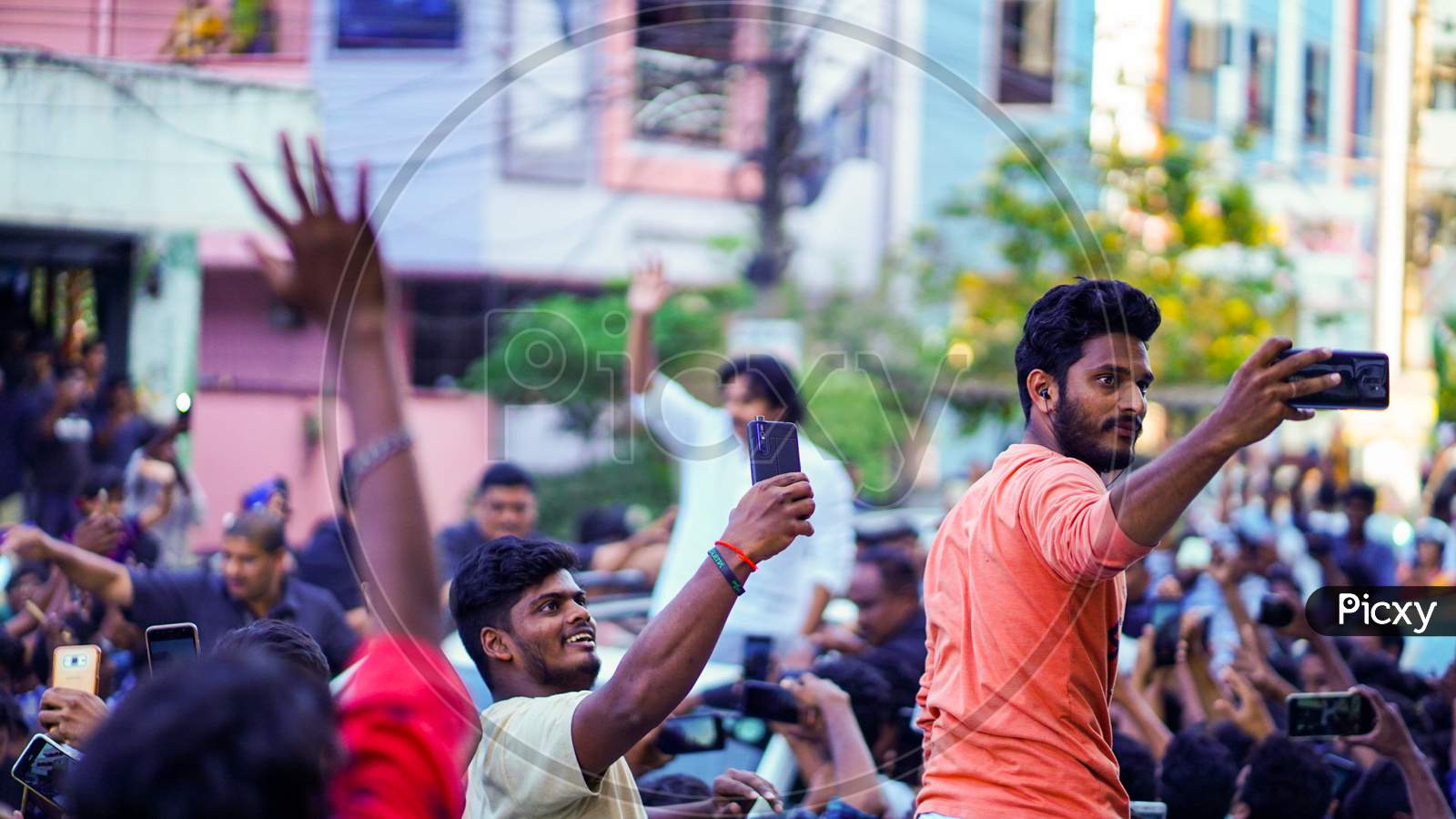 people taking selfies with pawan kalyan. 