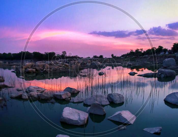 Reflection Of Sunset Sky At a Lake