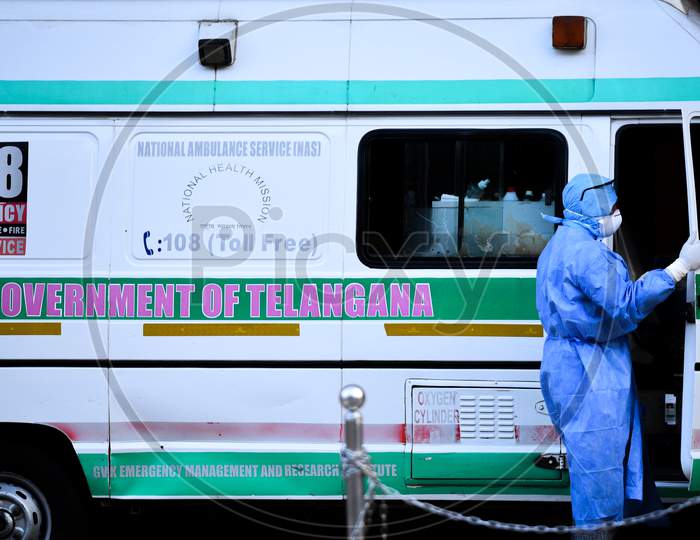 A 108 Ambulance driver wears Full Body Suit and Face Masks at COVID19, Corona Virus Isolation Ward