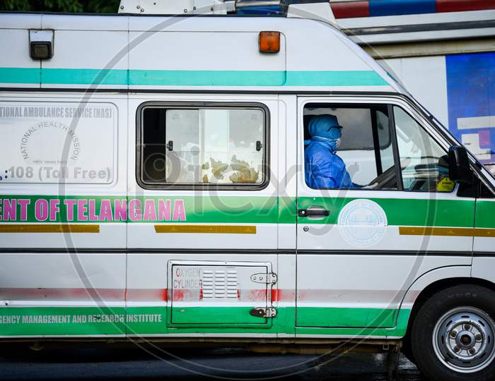 An Ambulance driver wearing full body suit and face mask at Corona Virus Isolation ward at Gandhi Hospital,Hyderabad.