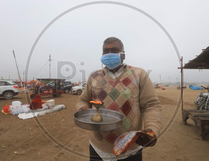 Hindu  Devotee  Wearing Surgical Mask For Safety From Corona Virus Outbreak  In India At Prayagraj