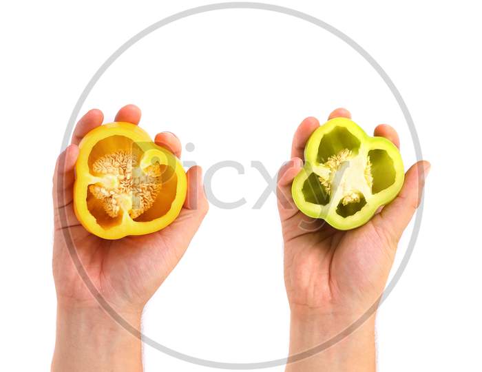 Hand Hold Two Halfs Of Bell Pepper On White Background