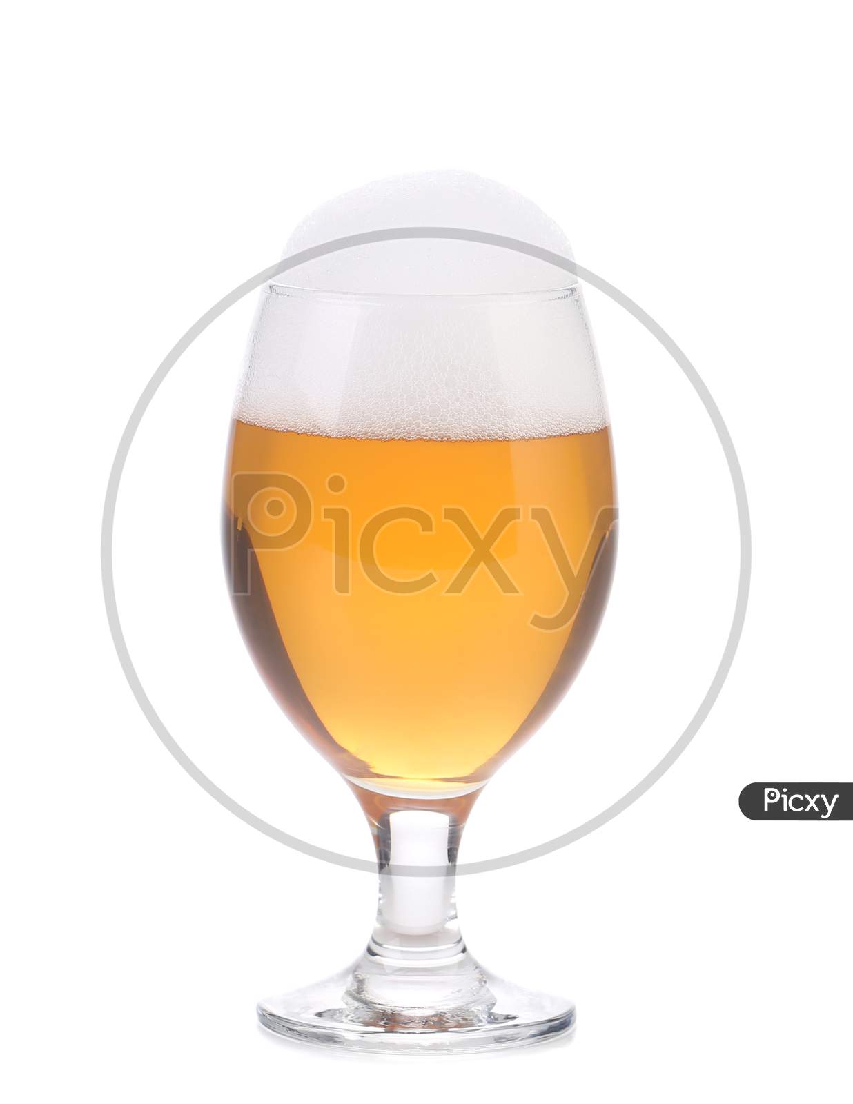 Closeup Of Beer Glass With Foam. Isolated On A White Background.