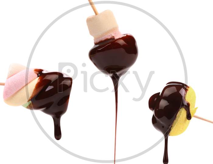 Marshmallows In Chocolate Syrop. Isolated On White Background