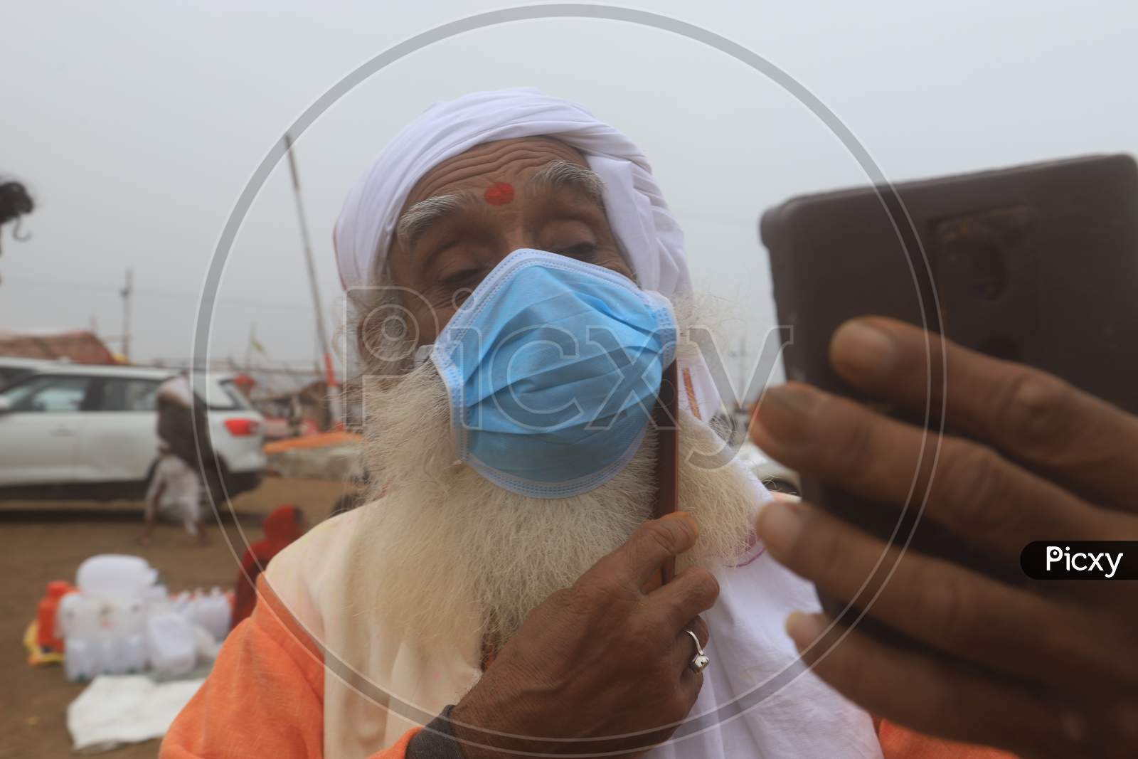 Hindu  Sadu Or baba Wearing Surgical Mask For Safety From Corona Virus Outbreak  In India At Prayagraj