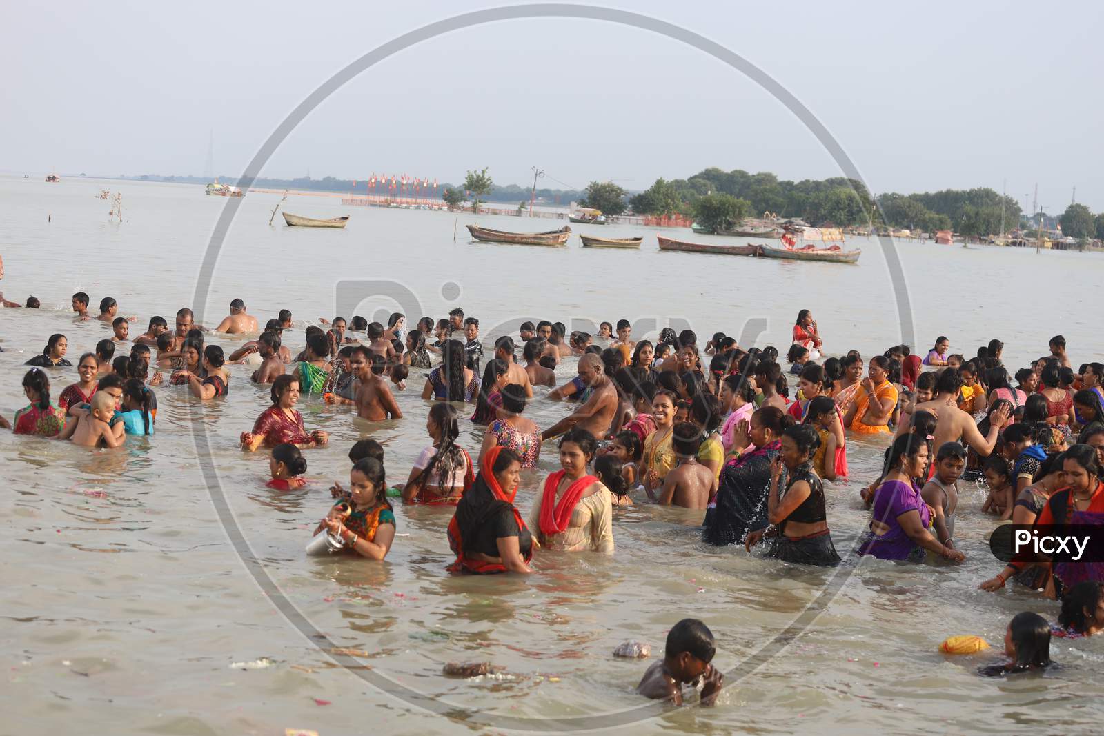 Image Of Hindu Devotees Or Pilgrims Taking Holy Bath In Triveni Sangam River At Prayagraj