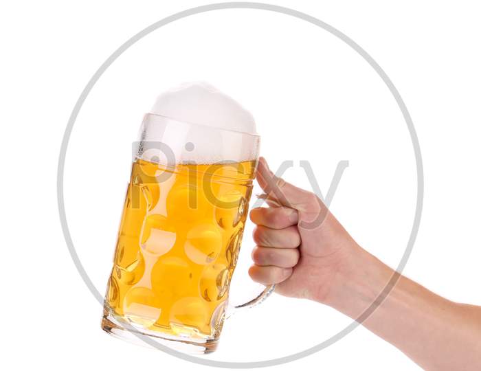 Hand Holds Mug Of Fresh Beer With Foam. Close Up