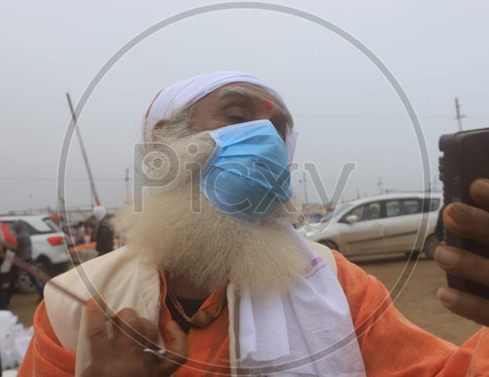 Hindu  Sadu Or baba Wearing Surgical Mask For Safety From Corona Virus Outbreak  In India At Prayagraj
