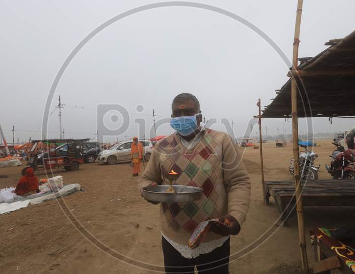 Hindu  Devotee  Wearing Surgical Mask For Safety From Corona Virus Outbreak  In India At Prayagraj