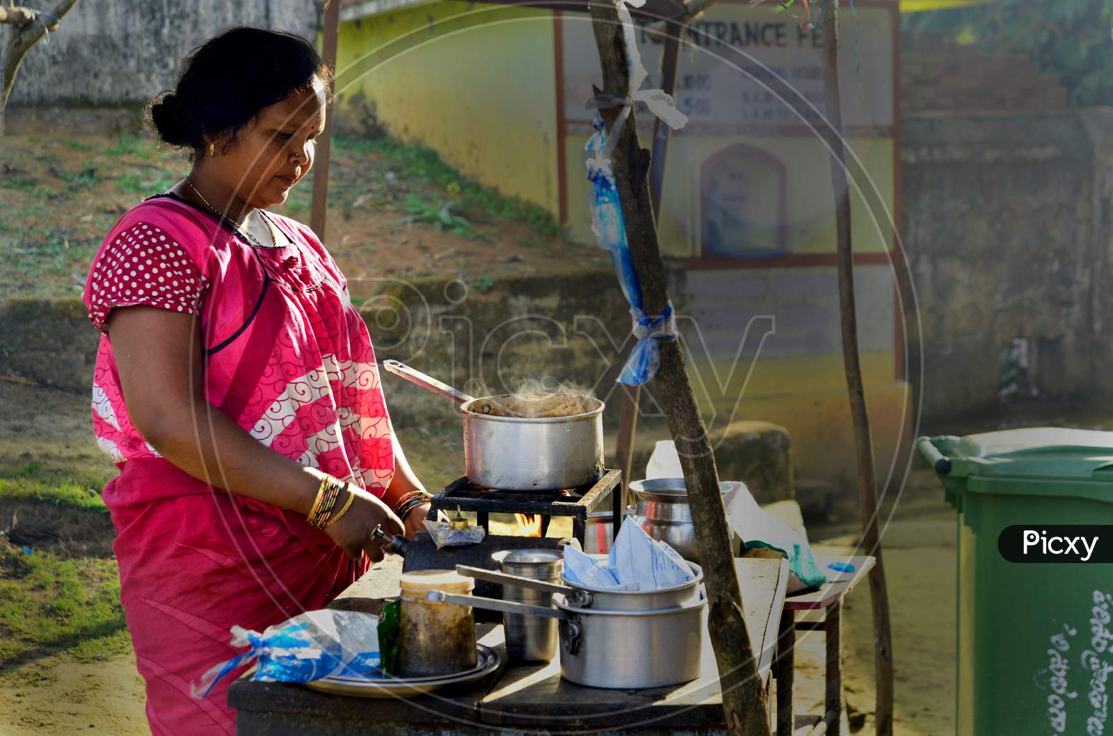 A Woman Making Tea A Road Side Tea Vendor Stall In India