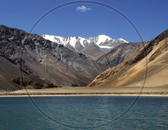 A View Of Snow Capped Mountains And Pangong Lake  In Leh