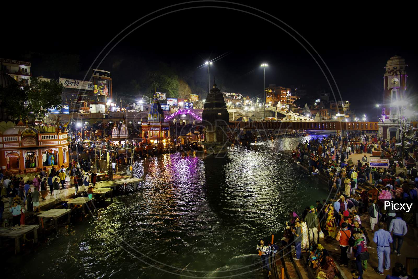 Crowd of Hindu Devotees Taking Holy Bath in Ganga River At Haridwar