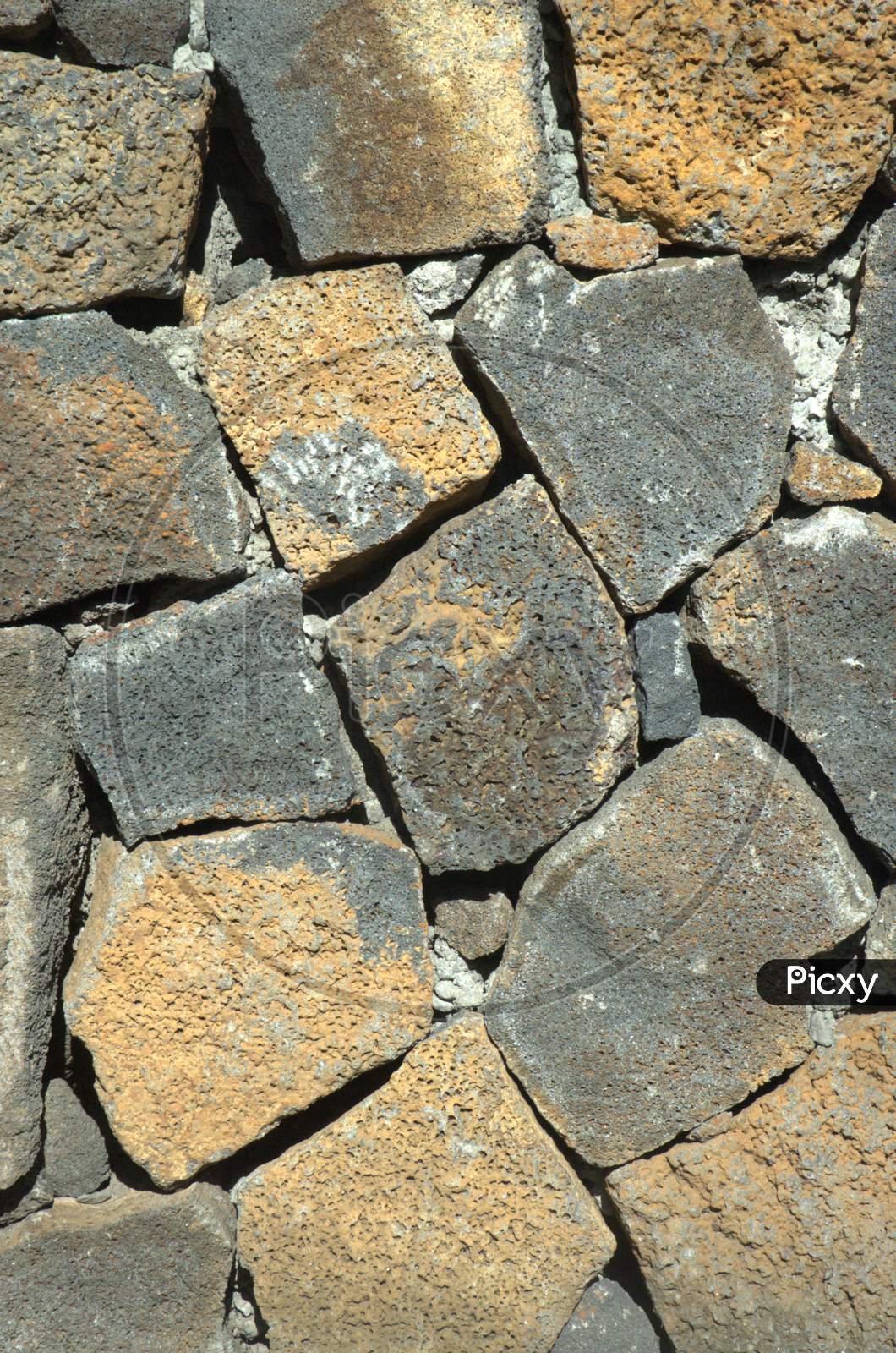 Texture And Patterns Of Stones At a Beach
