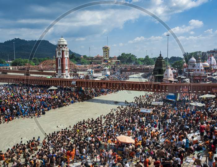Crowd of Hindu Devotees Taking Holy Bath in Ganga River At Haridwar