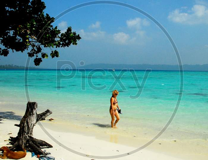 A Foreign Woman Walking Along The Beach In Andaman