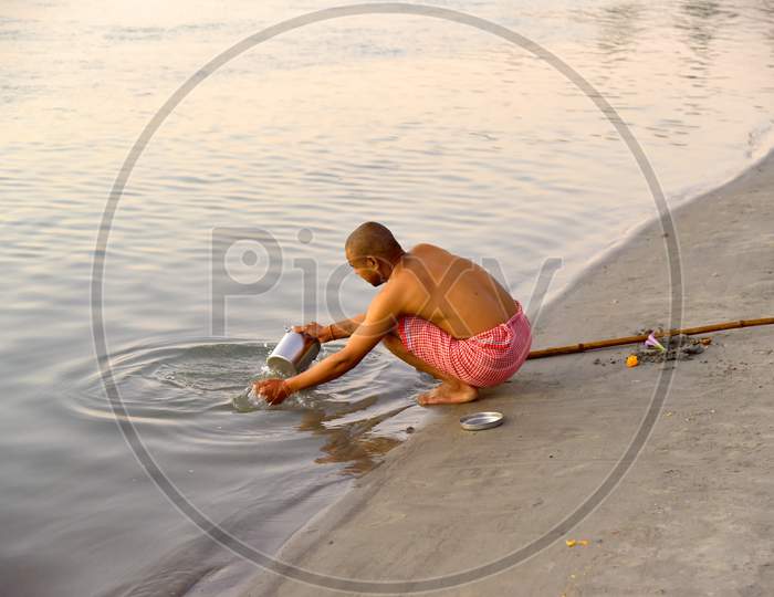 Hindu Devotees Performing Daily Morning Rituals In River Ganga , Haridwar