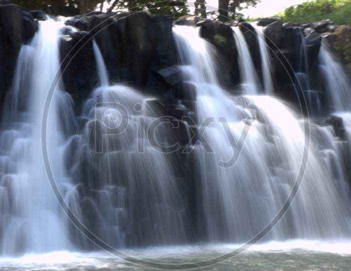Smooth Texture Of Water Flowing Stream At a Waterfalls
