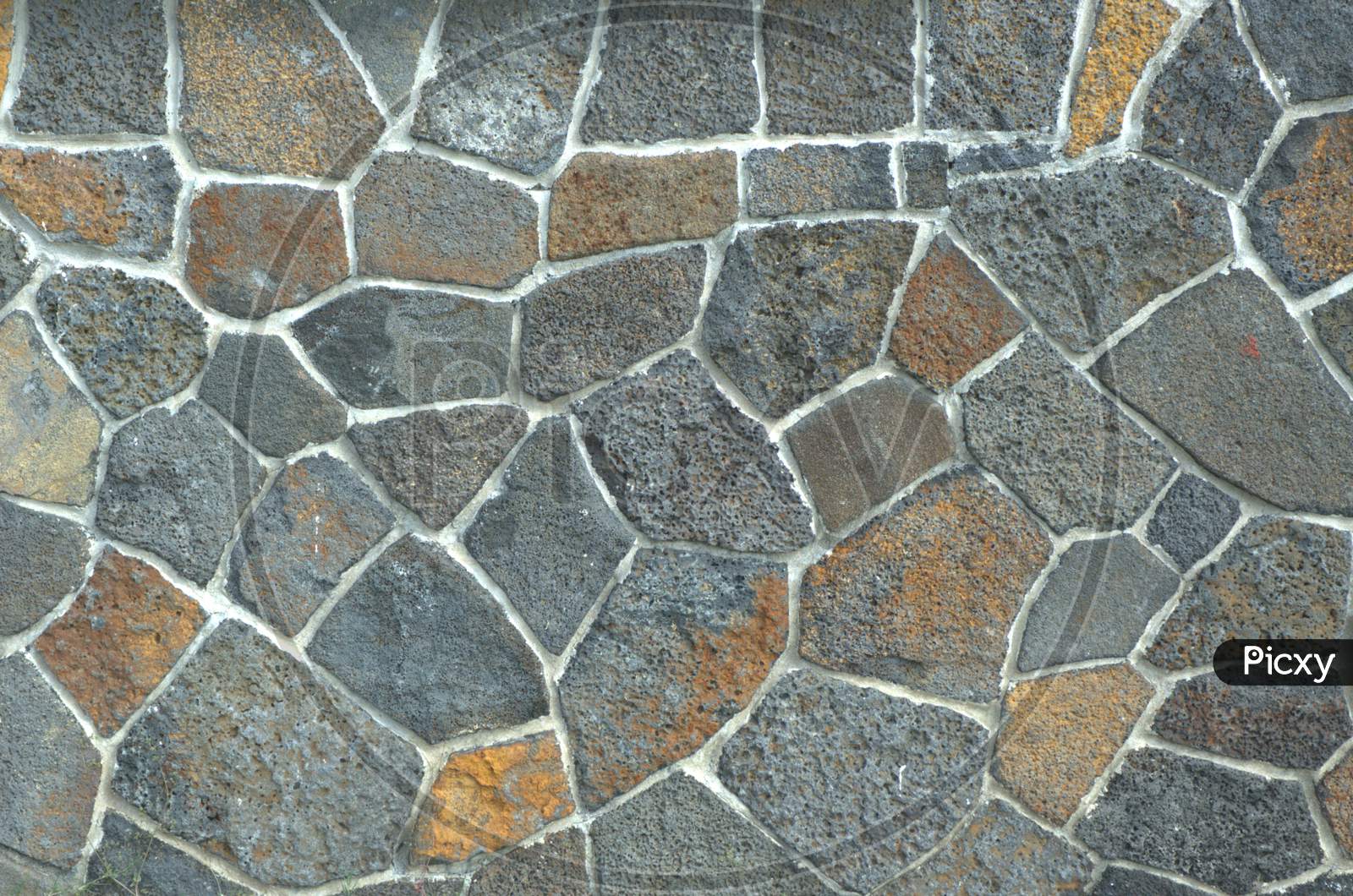 Patterns On a Wall With Stones