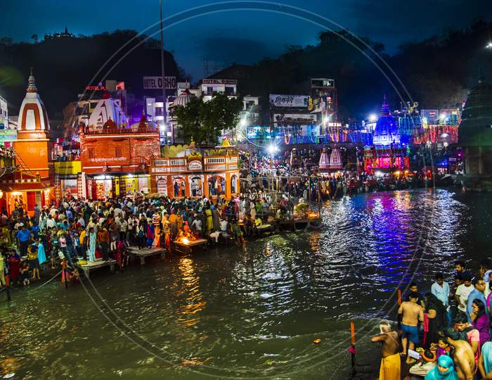 Devotees Offering Prayers On The Bank Of River Ganga During Ganga Aarthi Or Harathi In Haridwar