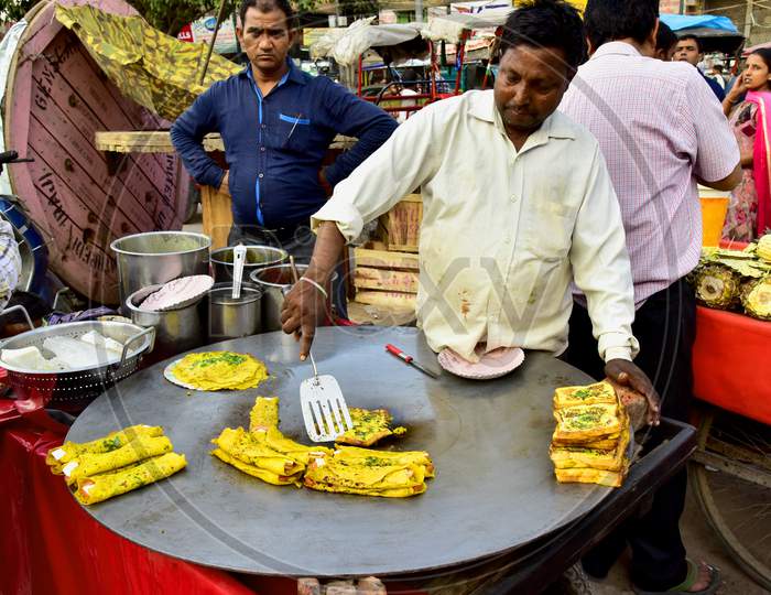 Street Food Vendor Making Bread Omelette At a Street Food Vendor Stall