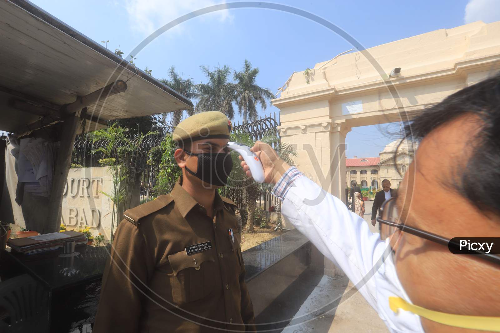 A Doctor Checking CISF Security Personnel With Thermal Scanner For Corona Or COVID 19