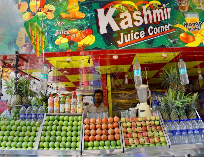 Fresh Fruit Juice Center With Fresh Fruits In Display