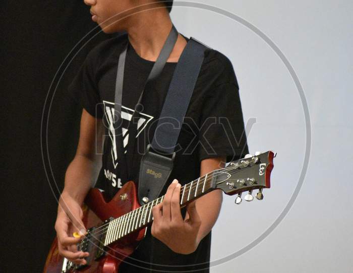 v5 band. kid playing guitar