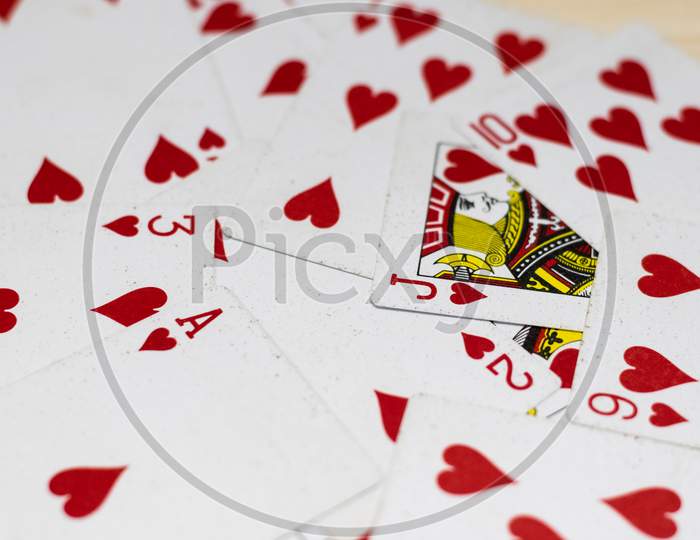 focused ace of hearts playing card with other blurred cards