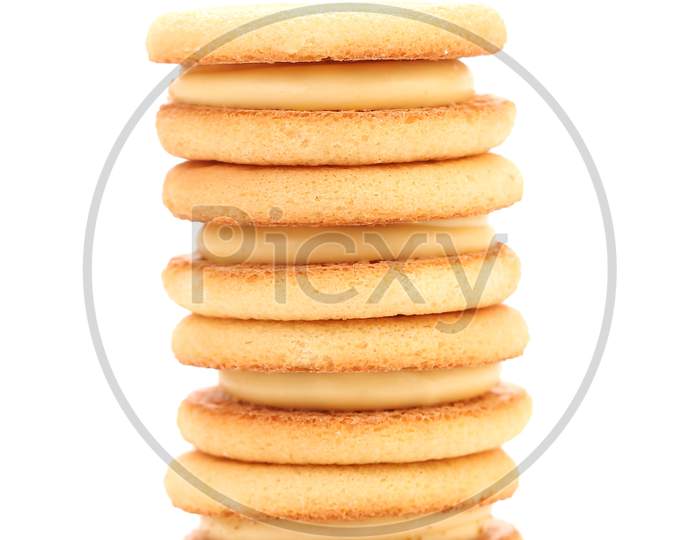 Stack Of Sandwich Biscuits With White Cream. Isolated On A White Background.