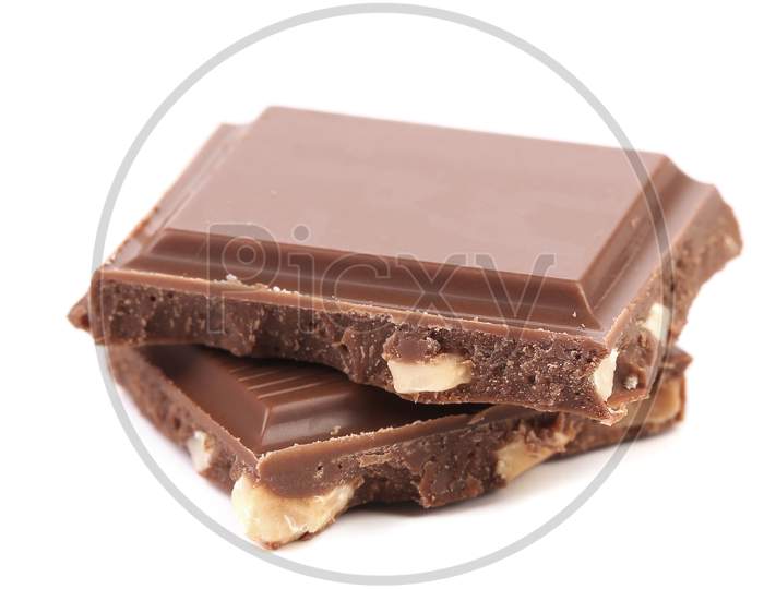 Two Broken Chocolate Bars With Nuts. Isolated On A White Background.