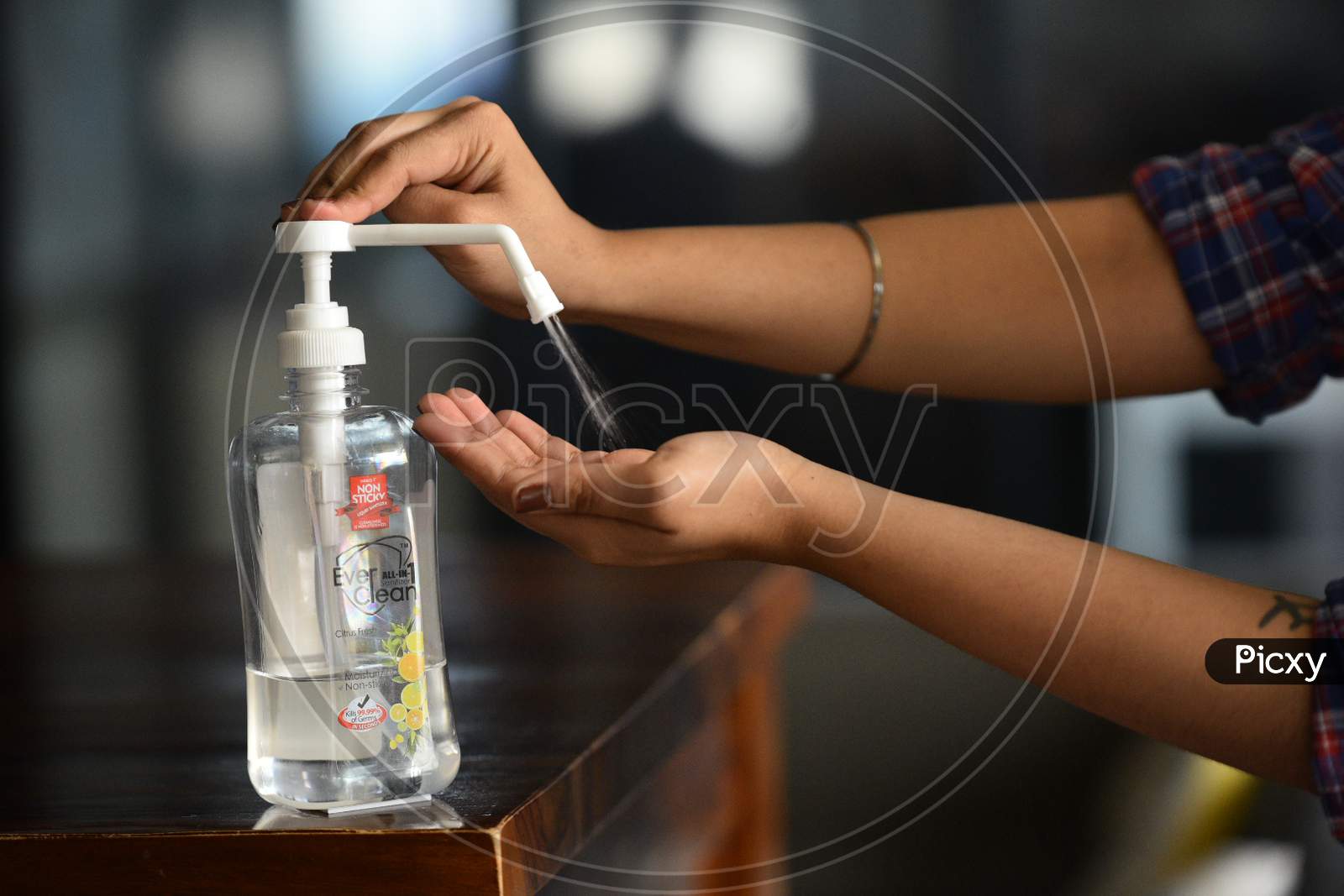 Using Hand Sanitizer to wash Hands to kill the pathogen virus entry into human body
